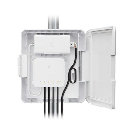 Internal compartment view of the USW-Flex-Utility housing showing the pre-installed 60W power adapter, power supply bracket, integrated grounding point, and an RJ45 PoE patch cord.