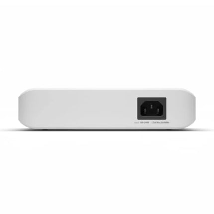 Rear three-quarter perspective of the compact Ubiquiti UniFi 16-port Lite switch, showcasing its internal power supply plug connection and fully silent, fanless thermal cooling chassis.