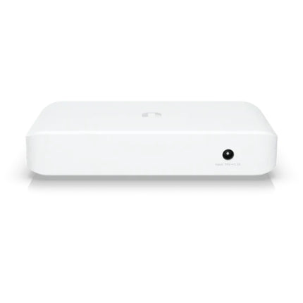 Rear angle of the compact Ubiquiti UniFi 8-port Lite switch showcasing the external 54V DC power input jack and the fully silent, fanless thermal venting enclosure.