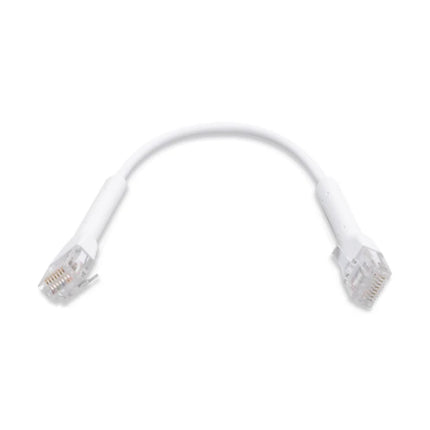 Close-up view of ultra-thin white RJ45 connector boot bent at a 90-degree angle.