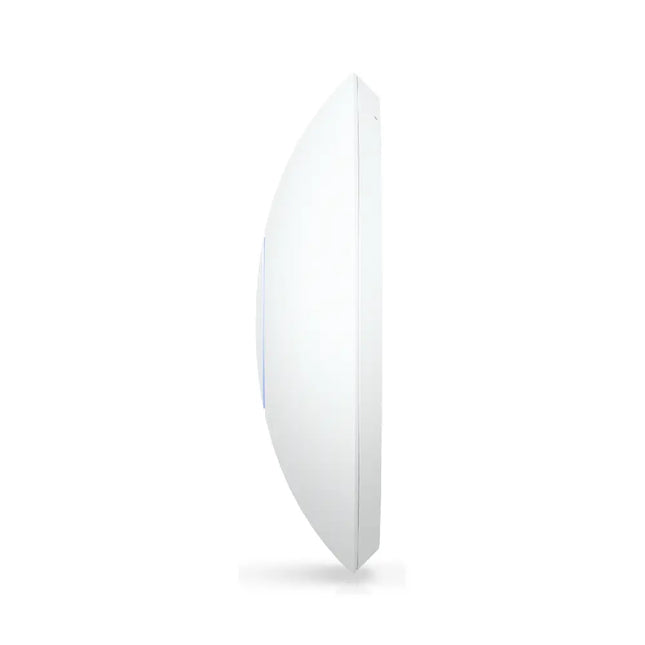 An angled view of the UniFi U7 LR high-performance WiFi 7 access point mounted securely onto a white ceiling.