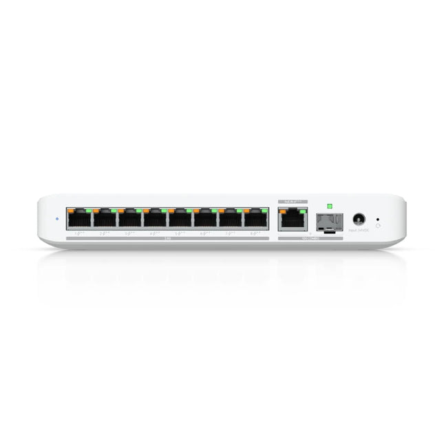 High-angle studio view of the sleek, compact matte white housing of the UniFi USW-Flex-2.5G-8-PoE network switch, featuring a fanless design for silent desktop or wall-mount deployment.