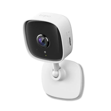 Close-up front view of the TP-Link TC60 camera lens, highlighting its built-in microphone and night vision sensors.
